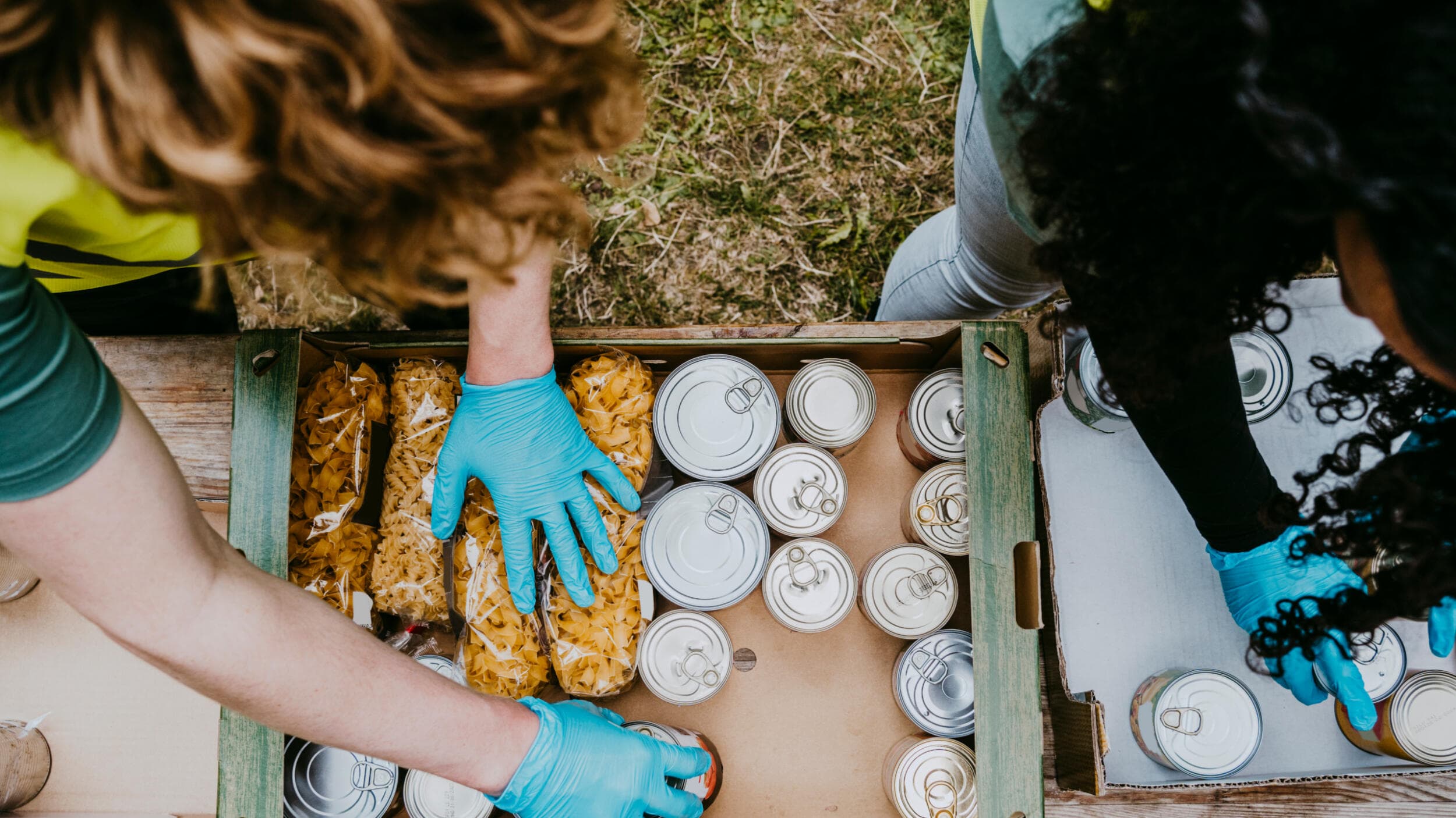 An overhead shot of community workers collecting food for donation.